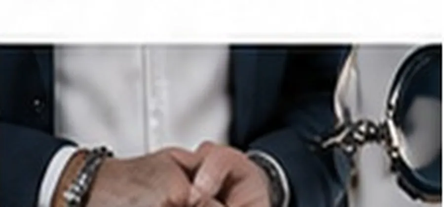 Hands in handcuffs representing criminal defense law